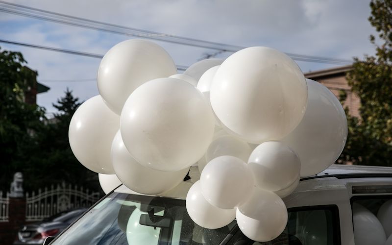 balloons falling out of car